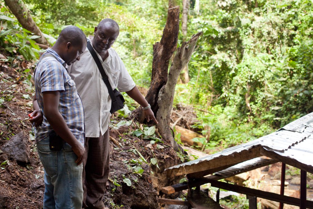 Jaba and Eyole discussing Manganjo catchment construction work